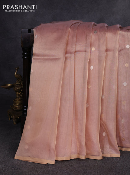 Banarasi tissue silk saree peach shade with allover zari woven buttas and zari woven piping border