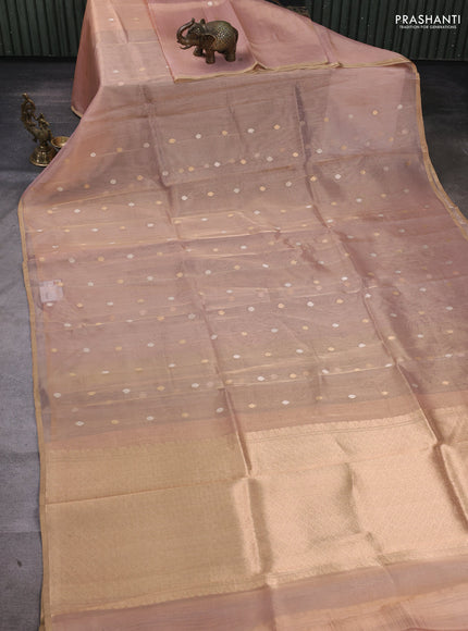 Banarasi tissue silk saree peach shade with allover zari woven buttas and zari woven piping border
