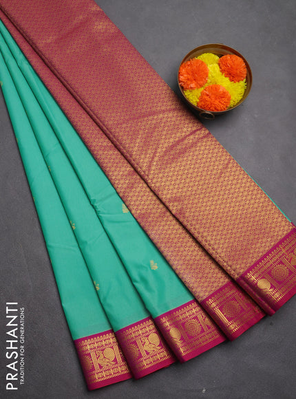 Semi kanchipuram silk saree teal green and pink with zari woven buttas and zari woven border