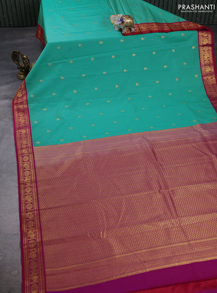 Semi kanchipuram silk saree teal green and pink with zari woven buttas and zari woven border