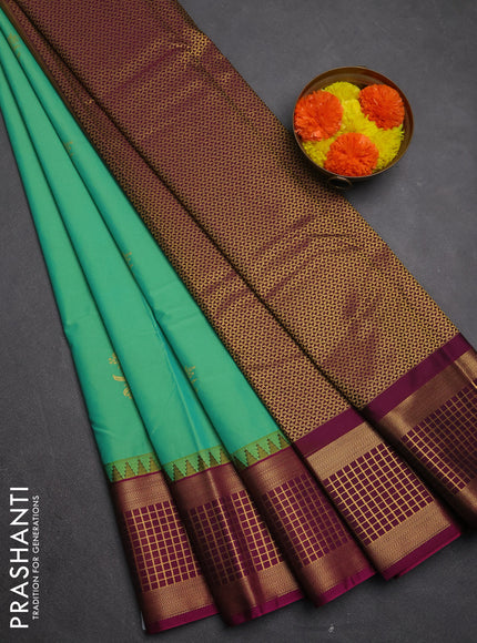 Semi kanchipuram silk saree teal green and magenta pink with zari woven buttas and temple design zari woven border