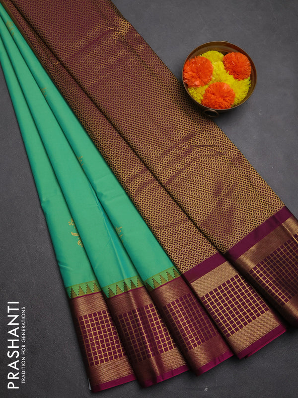 Semi kanchipuram silk saree teal green and magenta pink with zari woven buttas and temple design zari woven border