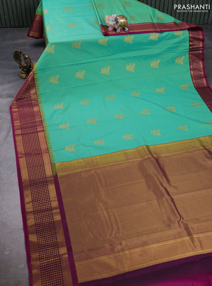 Semi kanchipuram silk saree teal green and magenta pink with zari woven buttas and temple design zari woven border