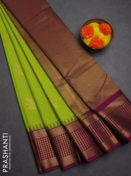 Semi kanchipuram silk saree light green and magenta pink with zari woven buttas and temple design zari woven border