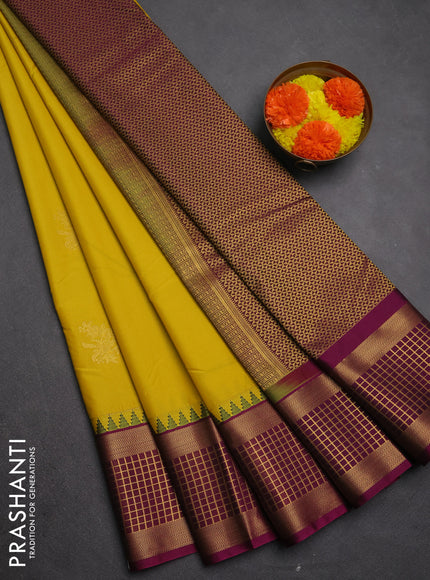 Semi kanchipuram silk saree yellow and magenta pink with zari woven buttas and temple design zari woven border