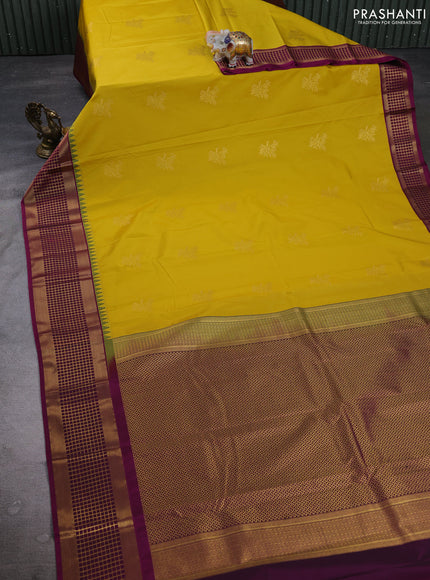 Semi kanchipuram silk saree yellow and magenta pink with zari woven buttas and temple design zari woven border