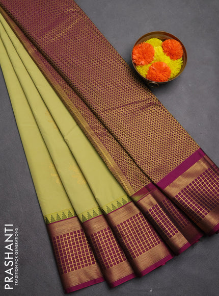 Semi kanchipuram silk saree elaichi green and magenta pink with zari woven buttas and temple design zari woven border