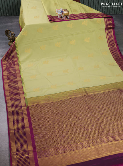 Semi kanchipuram silk saree elaichi green and magenta pink with zari woven buttas and temple design zari woven border