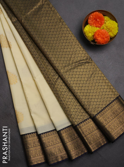 Semi kanchipuram silk saree off white and navy blue with zari woven buttas and temple design zari woven border