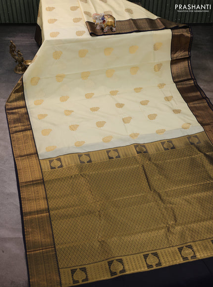 Semi kanchipuram silk saree off white and navy blue with zari woven buttas and temple design zari woven border