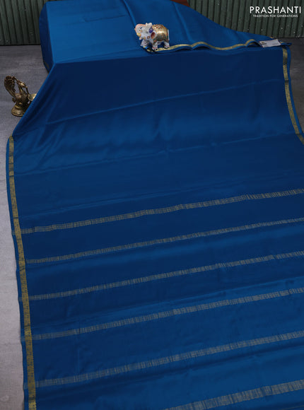 Pure mysore silk saree peacock blue with plain body and small zari woven border