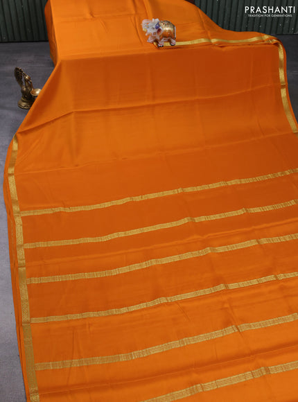 Pure mysore silk saree orange with plain body and small zari woven border