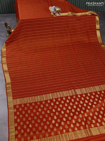 Pure mysore silk saree rustic orange with allover zari weaves and zari woven border