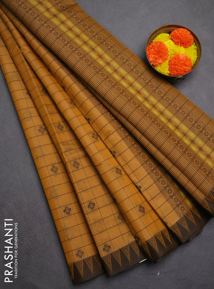 Kora silk cotton saree mustard yellow and black with allover thread checks & buttas and temple design thread woven border