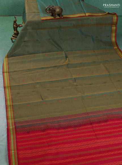 Kora silk cotton saree dual shade of green and maroon with paisley thread woven buttas and thread woven border