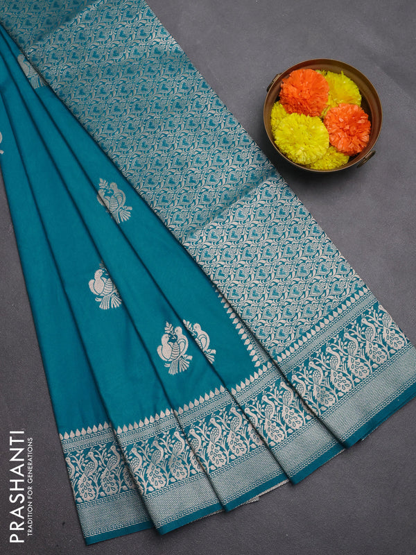 Semi soft silk saree teal blue with allover zari woven buttas and zari woven border