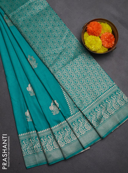 Semi soft silk saree teal blue with allover zari woven buttas and zari woven border