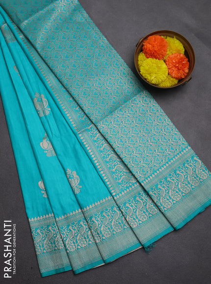 Semi soft silk saree teal green with allover zari woven buttas and zari woven border