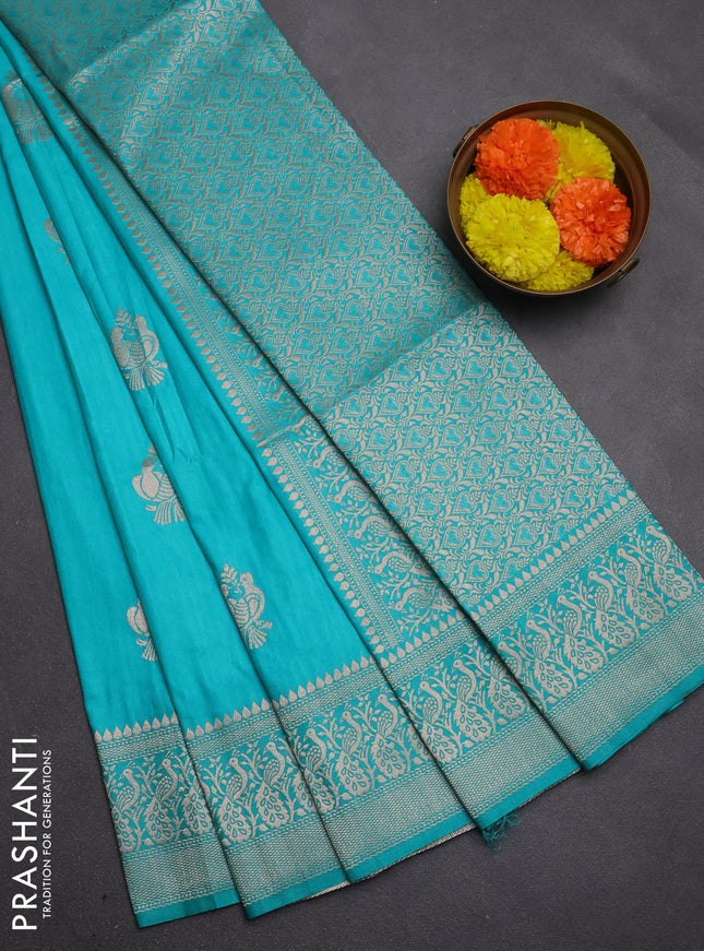 Semi soft silk saree teal green with allover zari woven buttas and zari woven border