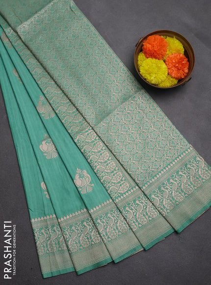 Semi soft silk saree pastel green shade with allover zari woven buttas and zari woven border