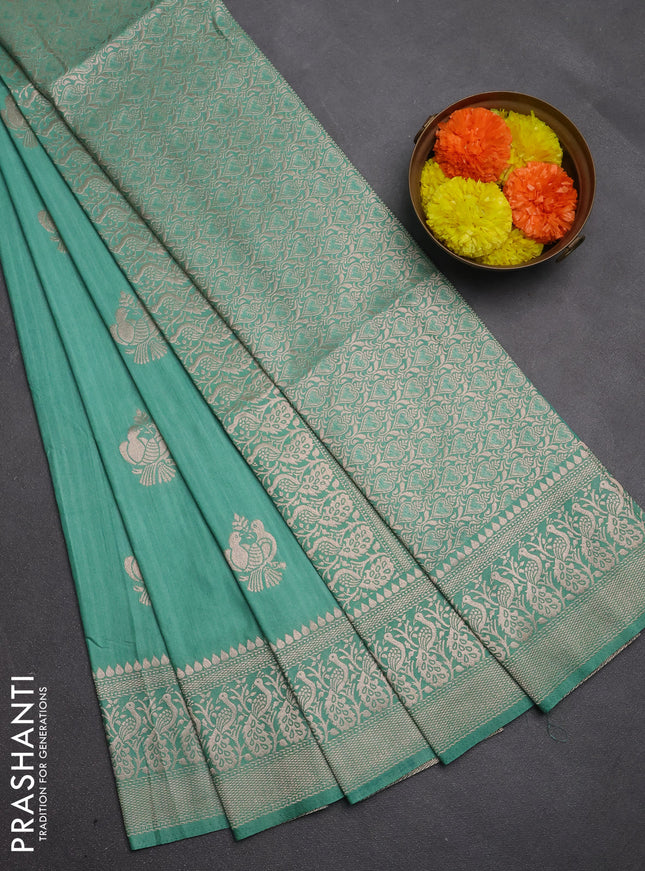 Semi soft silk saree pastel green shade with allover zari woven buttas and zari woven border