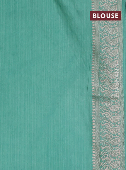 Semi soft silk saree pastel green shade with allover zari woven buttas and zari woven border