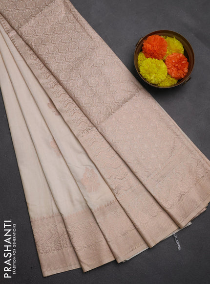 Semi soft silk saree cream with allover zari woven buttas and zari woven border