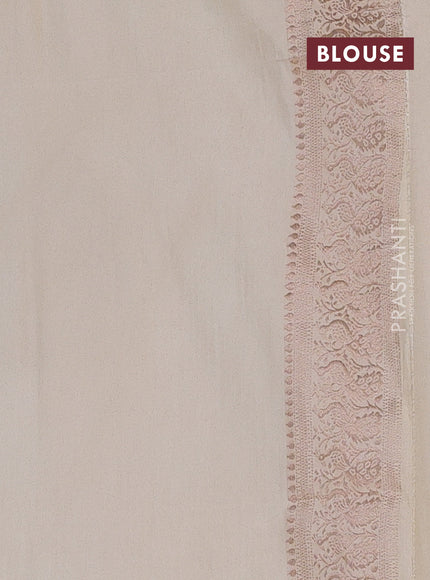 Semi soft silk saree cream with allover zari woven buttas and zari woven border