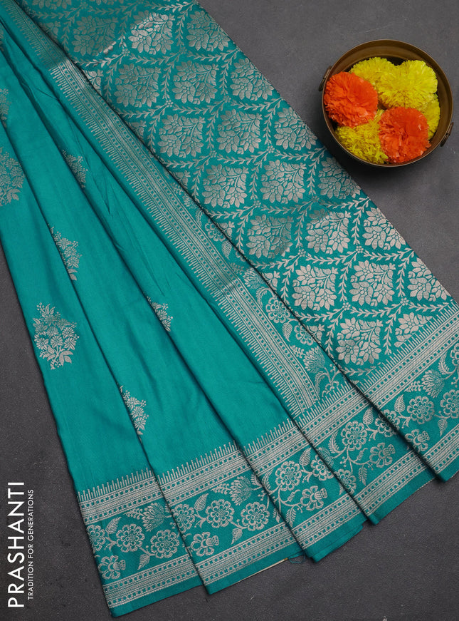 Semi soft silk saree teal blue with floral zari woven buttas and zari woven border