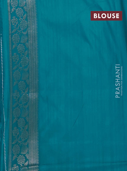 Semi soft silk saree teal blue with floral zari woven buttas and zari woven border