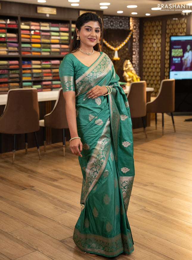 Semi soft silk saree pastel green with floral zari woven buttas and zari woven border