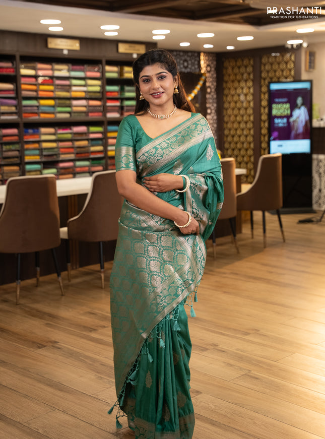 Semi soft silk saree pastel green with floral zari woven buttas and zari woven border