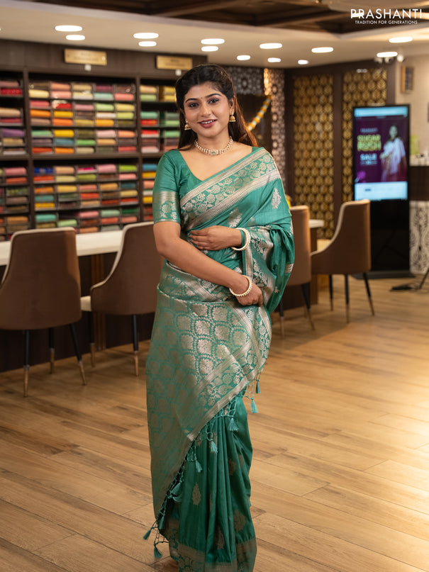 Semi soft silk saree pastel green with floral zari woven buttas and zari woven border