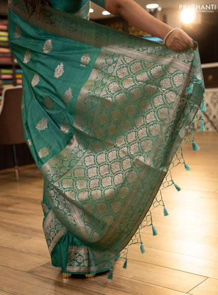Semi soft silk saree pastel green with floral zari woven buttas and zari woven border