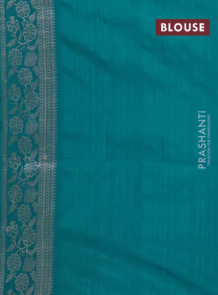 Semi soft silk saree teal green with floral zari woven buttas and zari woven border