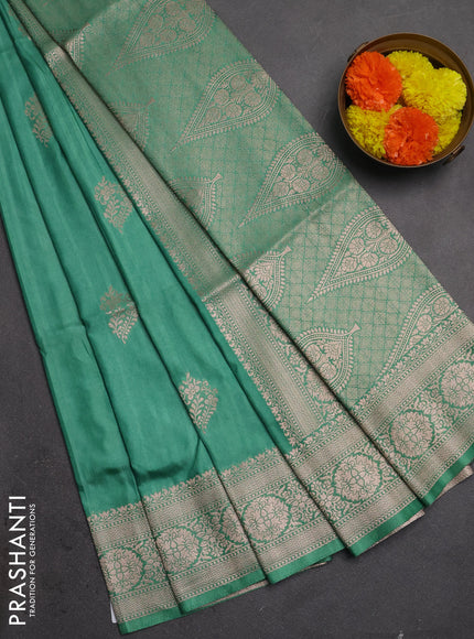 Semi soft silk saree pastel green with zari woven buttas and zari woven border
