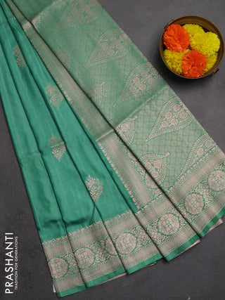 Semi soft silk saree pastel green with zari woven buttas and zari woven border