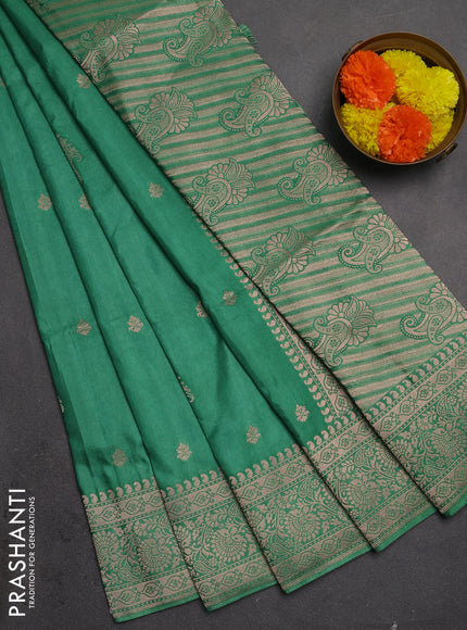 Semi soft silk saree pastel green with allover zari woven buttas and zari woven border