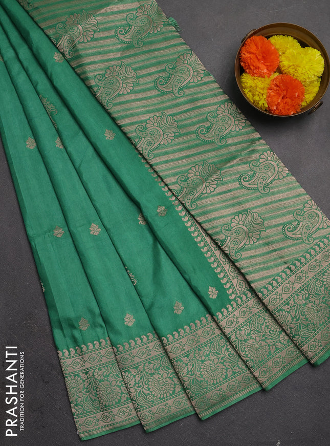Semi soft silk saree pastel green with allover zari woven buttas and zari woven border