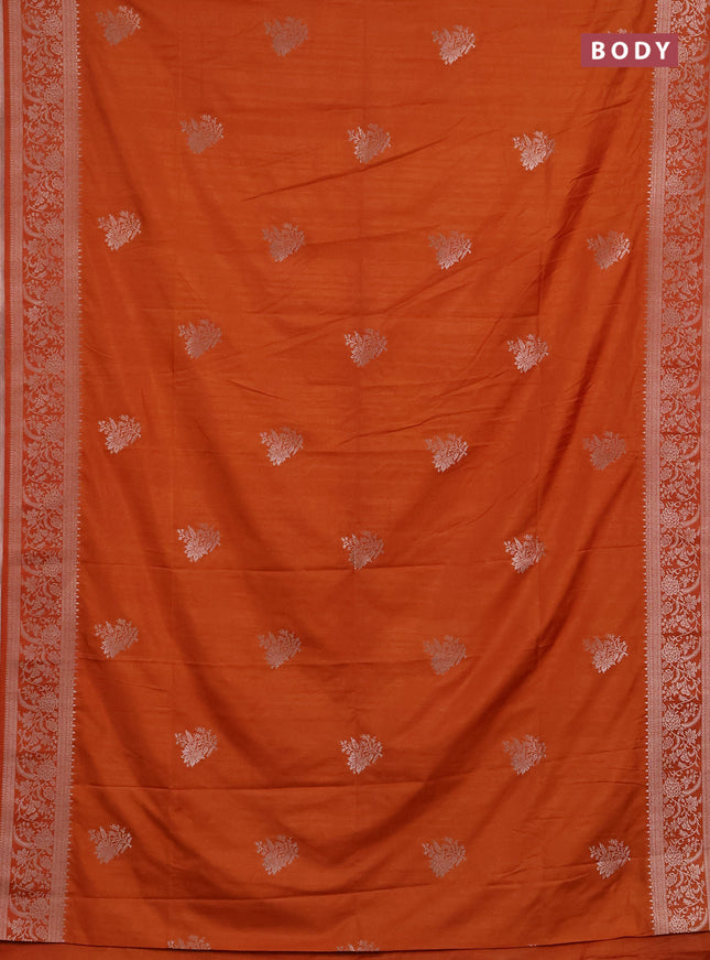 Semi soft silk saree rust shade with floral zari woven buttas and zari woven border