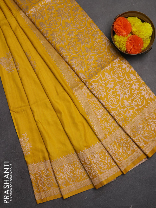 Semi soft silk saree mustard yellow with floral zari woven buttas and zari woven border