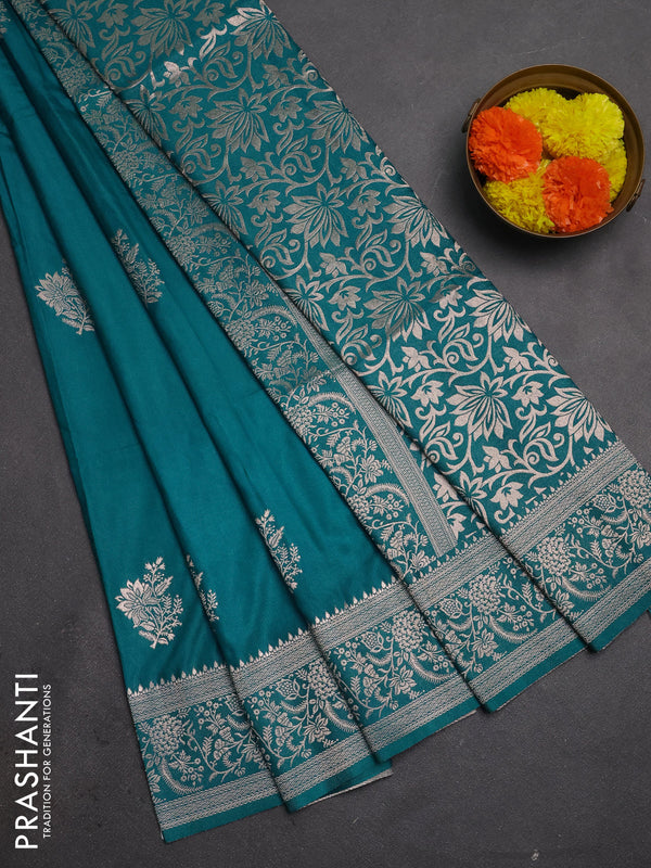 Semi soft silk saree teal green shade with floral zari woven buttas and zari woven border