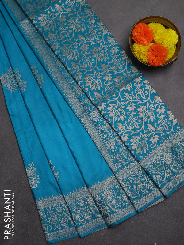 Semi soft silk saree teal blue with floral zari woven buttas and zari woven border