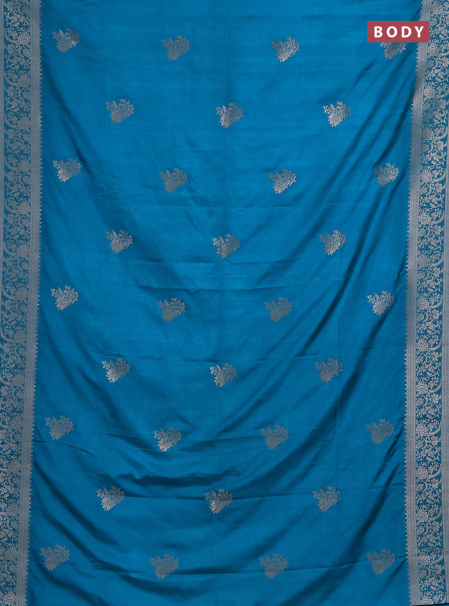 Semi soft silk saree teal blue with floral zari woven buttas and zari woven border