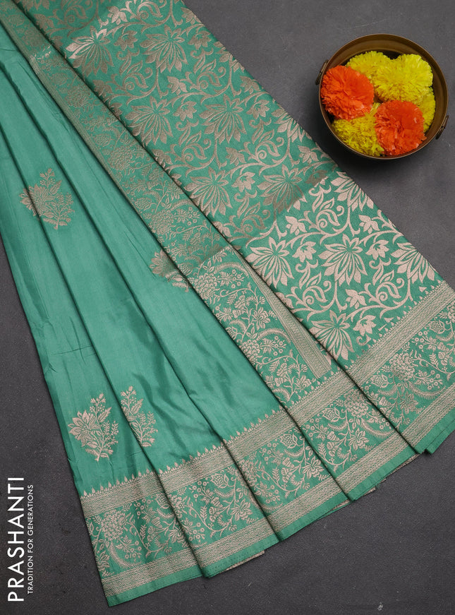 Semi soft silk saree pastel green with floral zari woven buttas and zari woven border