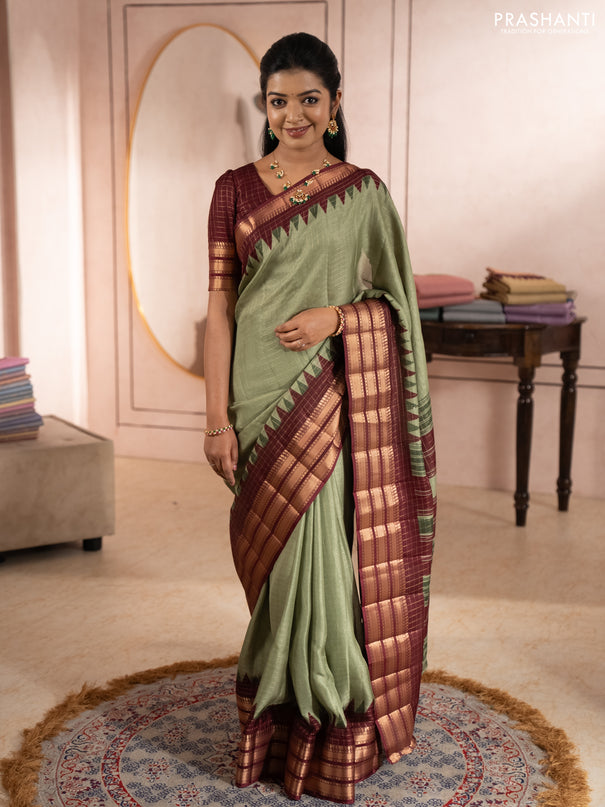 Semi raw silk saree pastel green and maroon with allover zari checked pattern and temple design zari woven border