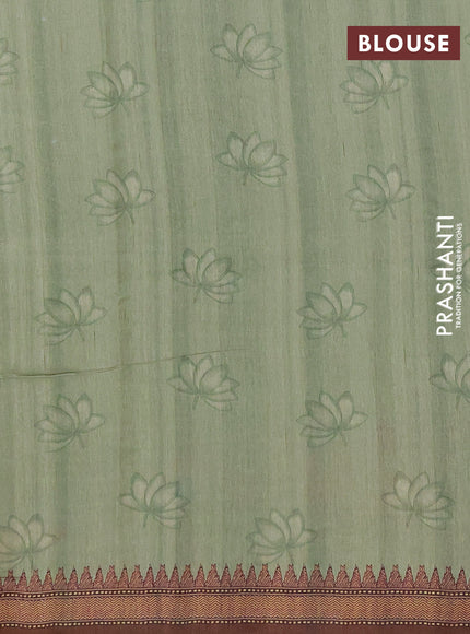 Semi raw silk saree elaichi green and coffee brown with mirror embroidery buttas and long kalamkari printed embroidery border