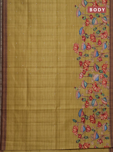Semi raw silk saree mustard yellow and coffee brown with mirror embroidery buttas and long kalamkari printed embroidery border