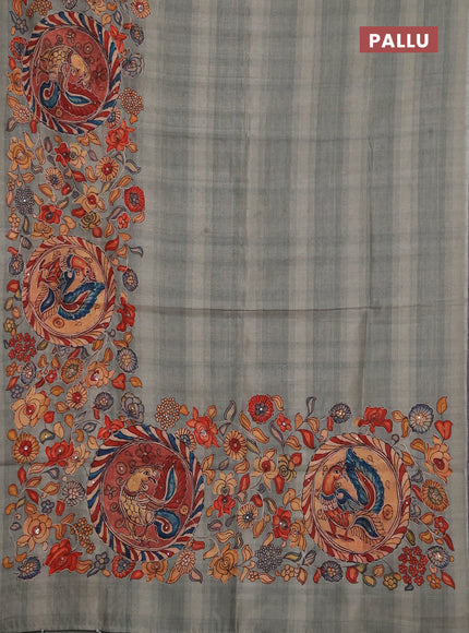 Semi raw silk saree pastel green shade with plain body and long kalamkari printed embroidery border