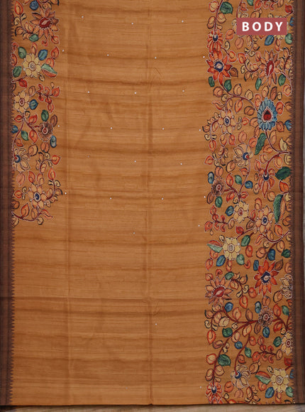 Semi raw silk saree rustic orange shade and coffee brown with mirror embroidery buttas and long kalamkari printed embroidery border